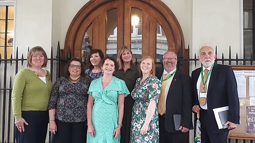 Attached photograph of Progressive Group outside Guildhall. From left to right: Cllr Diana Moore (G), Cllr Carol Bennett (G), Cllr Jemima Moore (Ind), Cllr Tess Read (G), Cllr Catherin Rees (G), Cllr Amy Sparling (G), Cllr Kevin Mitchell (LD), Cllr Michael Mitchell (LD)