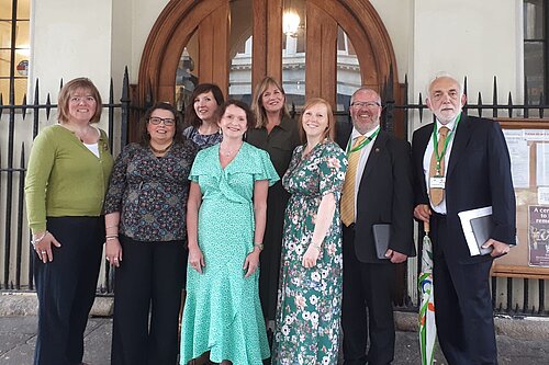 Attached photograph of Progressive Group outside Guildhall. From left to right: Cllr Diana Moore (G), Cllr Carol Bennett (G), Cllr Jemima Moore (Ind), Cllr Tess Read (G), Cllr Catherin Rees (G), Cllr Amy Sparling (G), Cllr Kevin Mitchell (LD), Cllr Michael Mitchell (LD)
