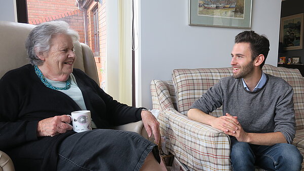 Will Aczel chatting with an Exeter pensioner