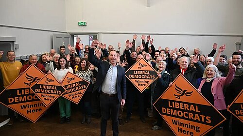 Richard Foord MP in front of a large crowd of Lib Dems