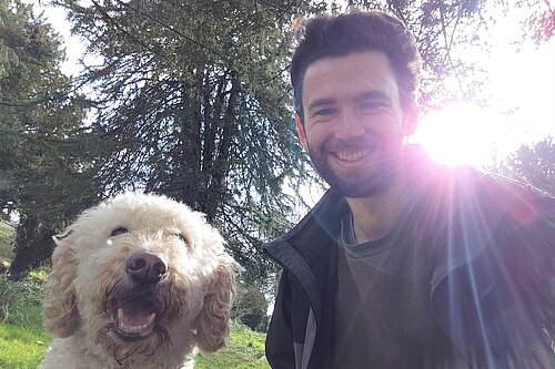 Will Aczel (pictured right) and Ayla the labradoodle (left) in an Exeter park