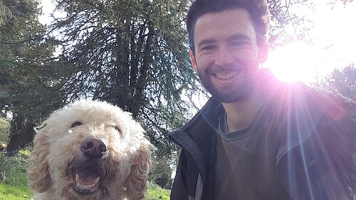 Will Aczel (pictured right) and Ayla the labradoodle (left) in an Exeter park