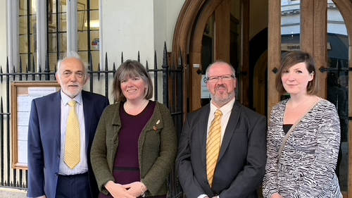 The four 2019 Progressive Group Councillors on Exeter City Council stand in front of the Guildhall. From left to right: Michael Mitchell (LD), Diana Moore (Grn), Kevin Michell (LD), Jemima Moore (Ind)